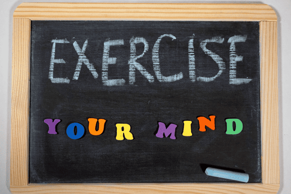 Exercise your mind written on a black slate