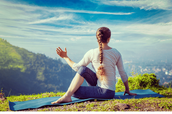 A woman practicing gentle Yoga 