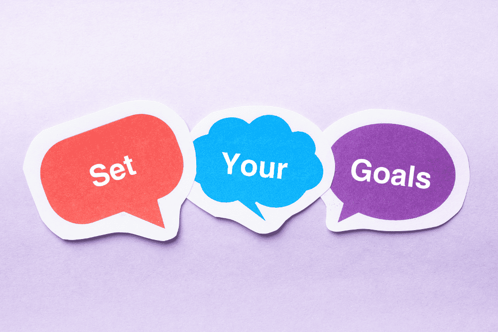 Set Your Goals written on lilac background.