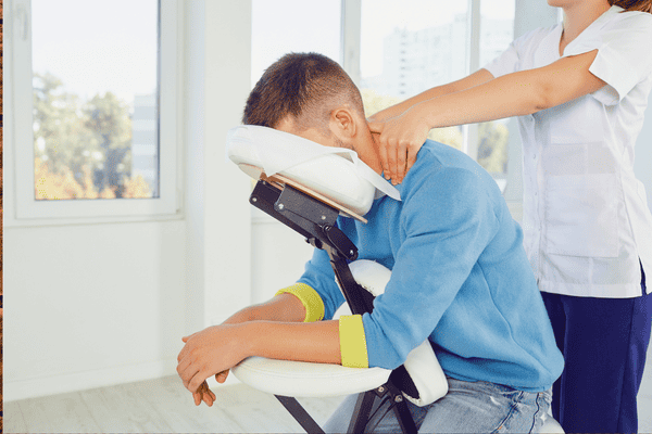 A man getting a chair massage