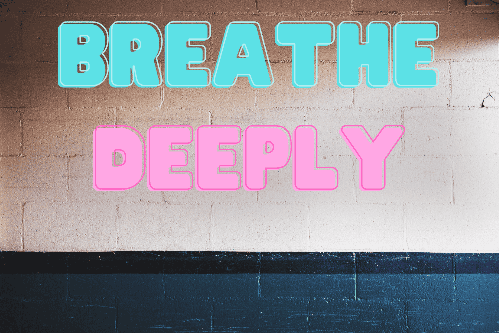 ''Breathe Deeply'' written on a bricked wall.