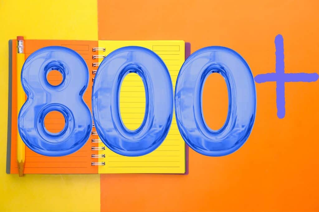 A large blue "800+" is placed over an open spiral notebook filled with vibrant journal prompts on orange and yellow pages, accompanied by a pencil on a vivid orange and yellow background.